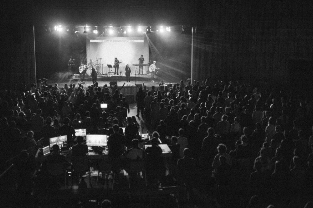 event hall, worshipping crowd